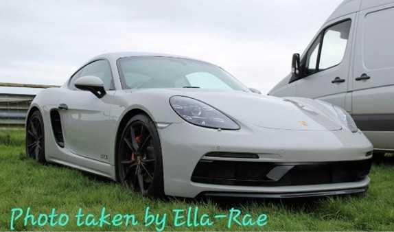 A silver Porsche 718 at Castle Combe taken and edited by el.photography52